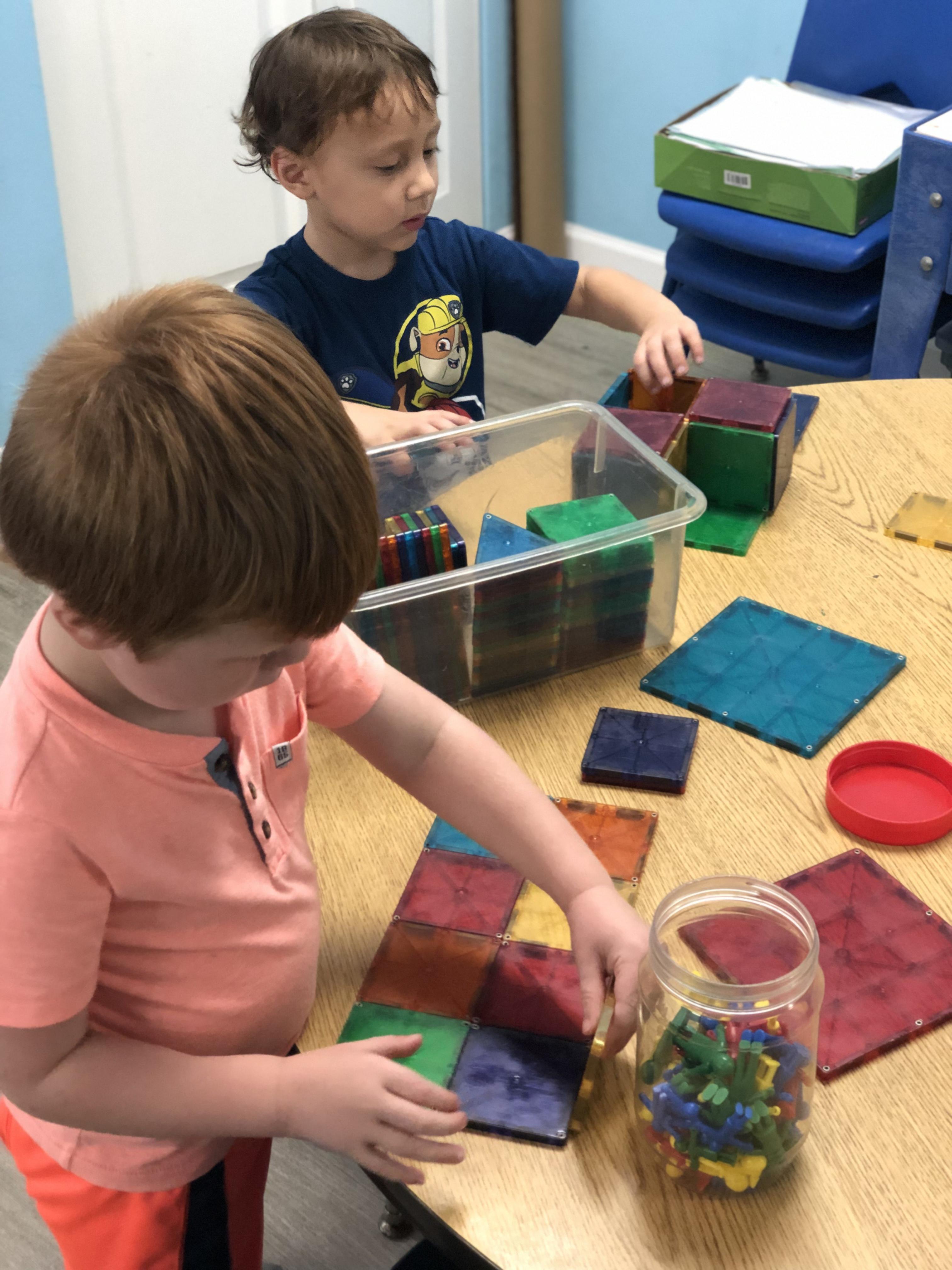 Child making art in a Toad Hall classroom