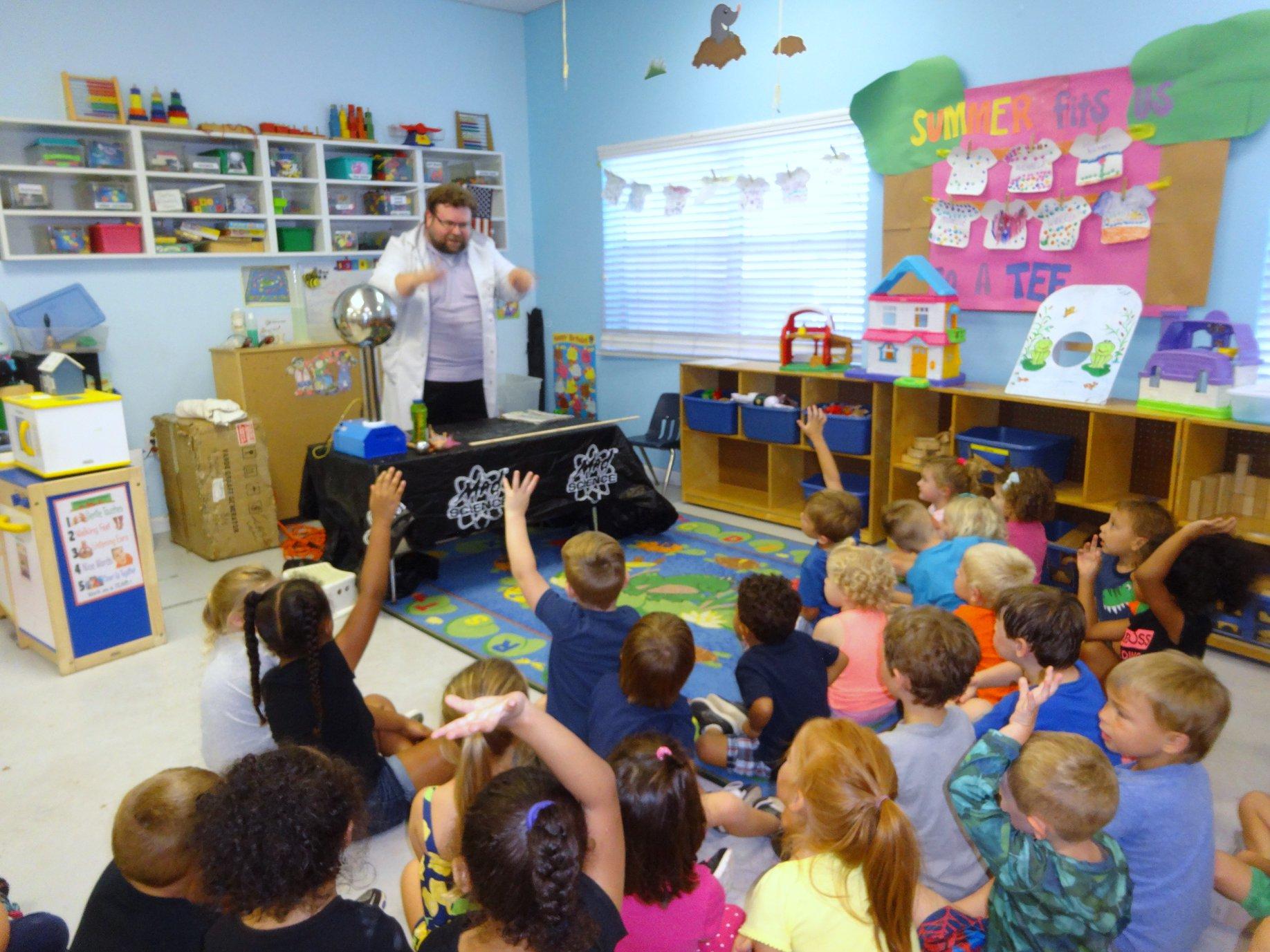 Children and adults gathered in a Toad Hall classroom